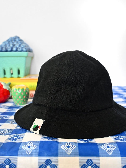 "Blackberry & Ant" Linen bucket hat. Designed by HO HOS HOLE IN THE WALL brand. Made in NYC.